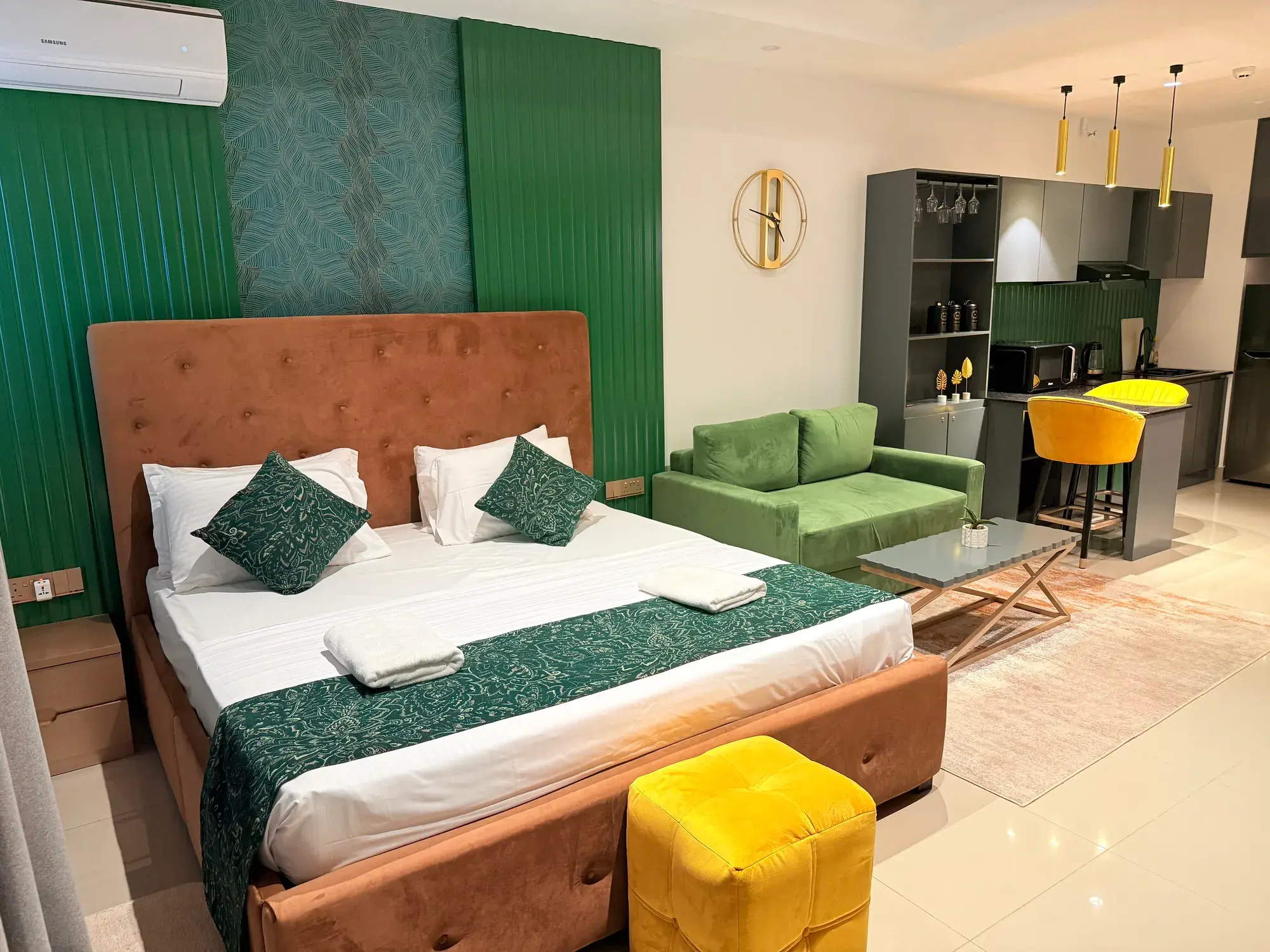 Bed, sofa and kitchen in one open room