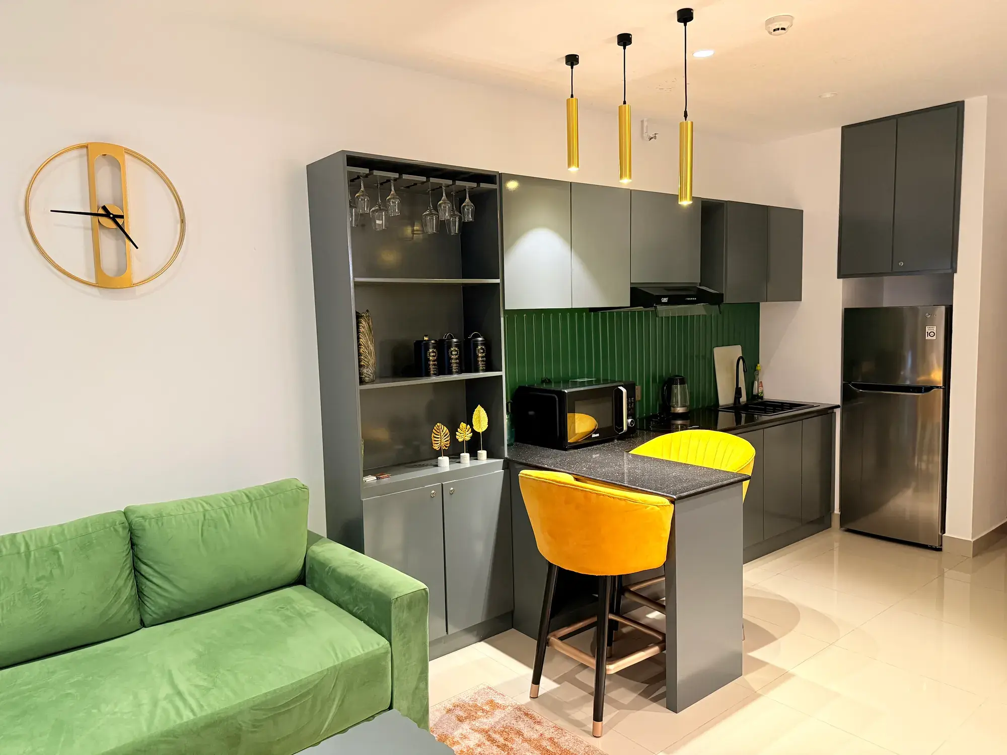 Kitchen with a breakfast counter and yellow stools