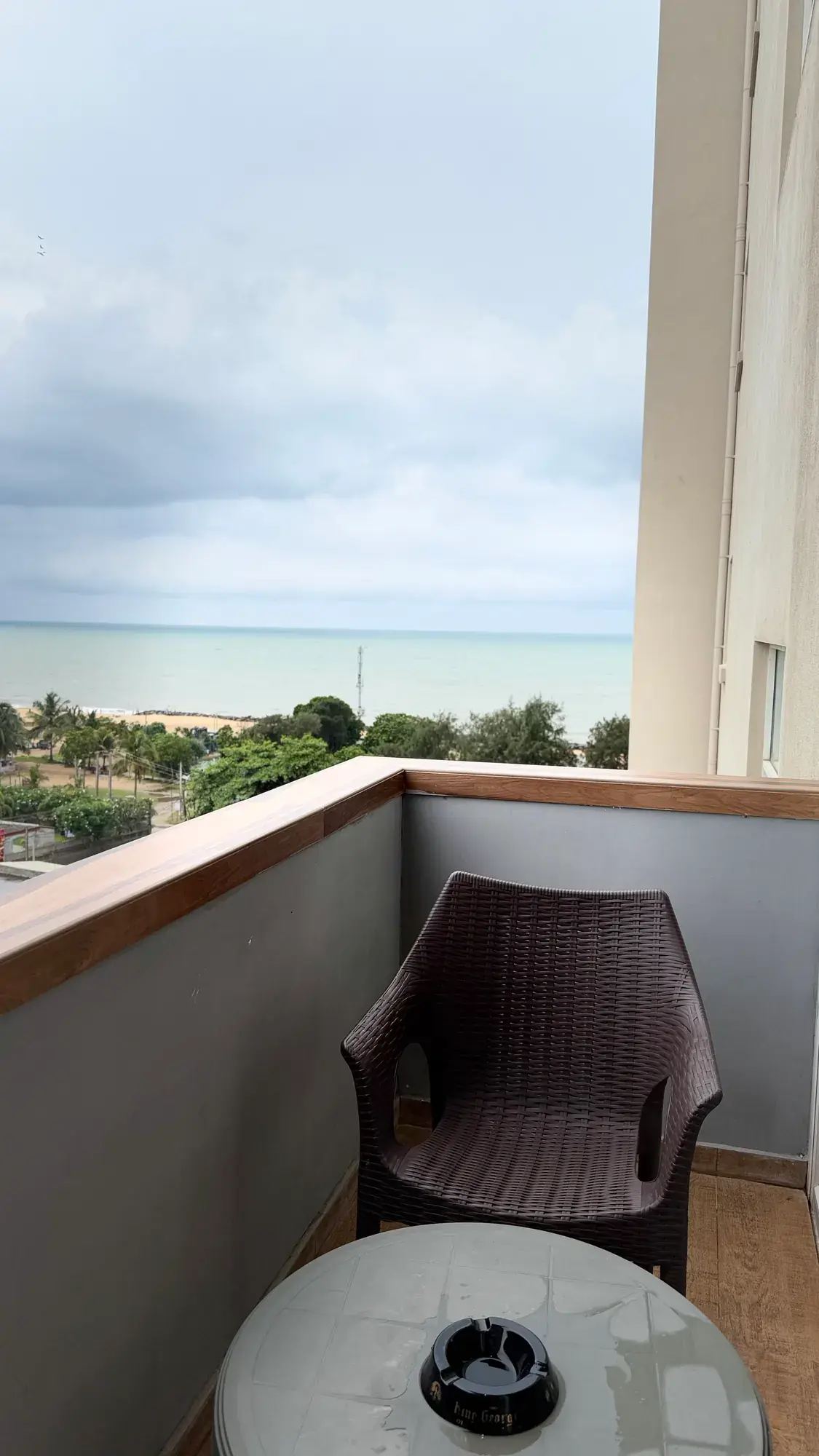 Balcony with a chair and small table