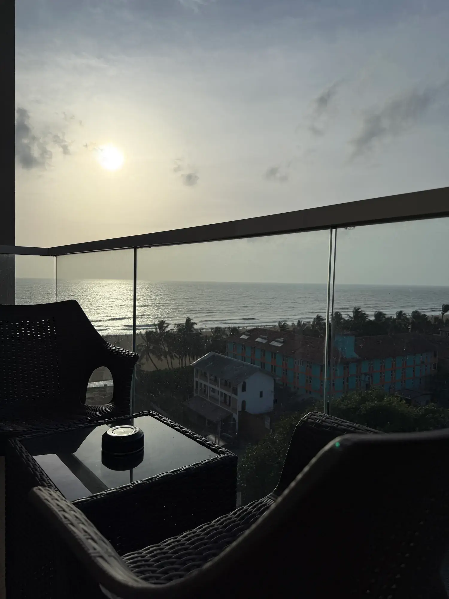 Balcony seating behind a glass railing