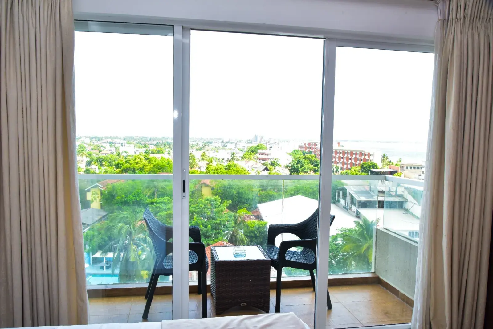 Balcony doors with chairs outside