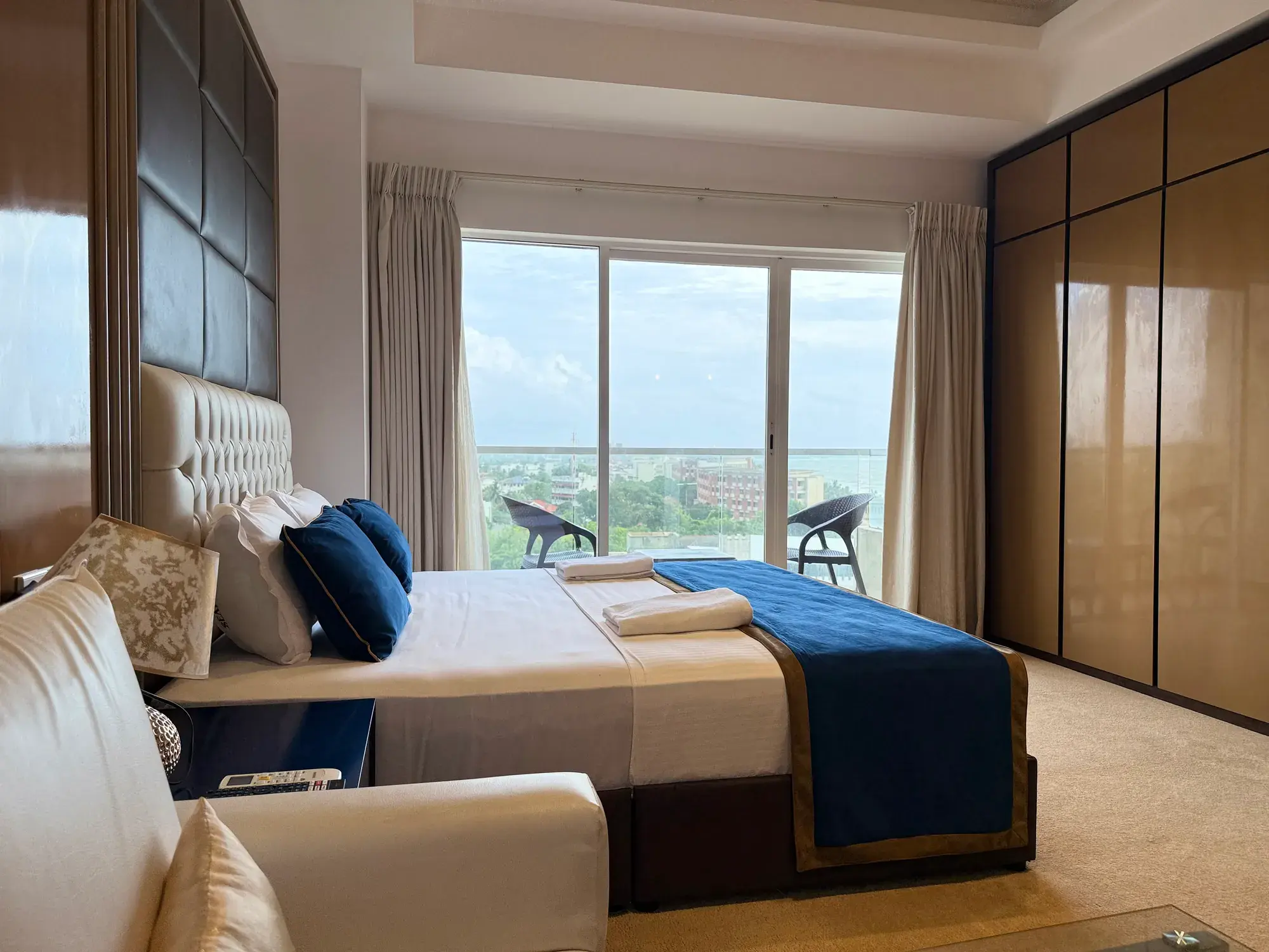 Bedroom with wardrobes and balcony doors