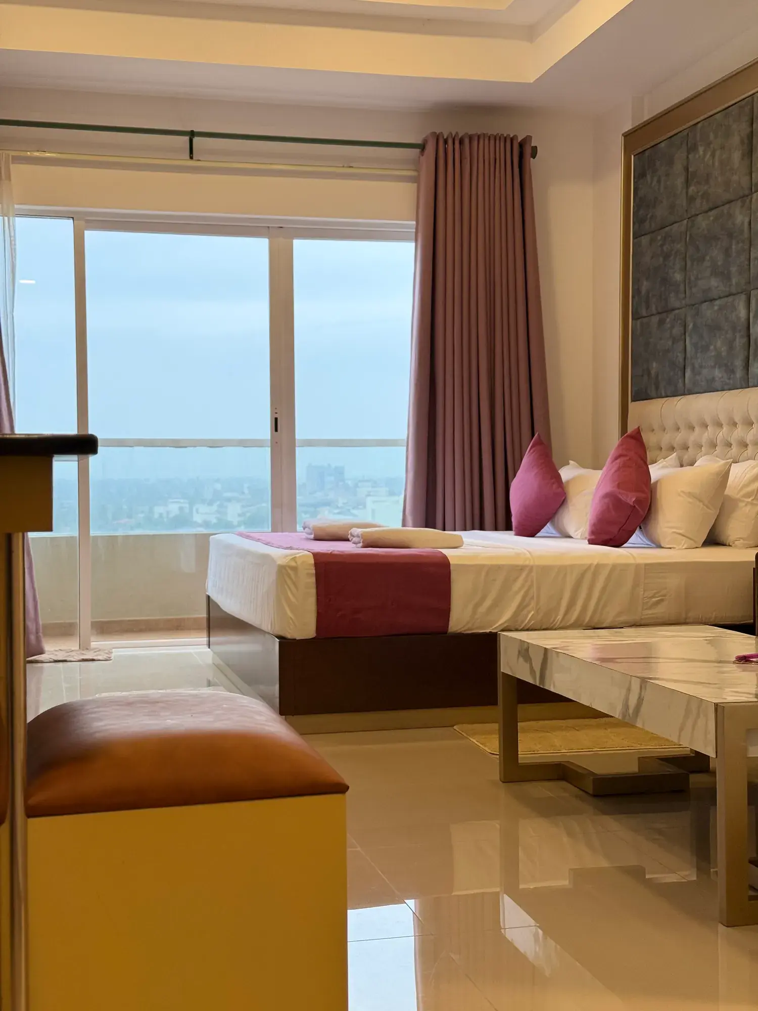 Open-plan room with the bed and sofa