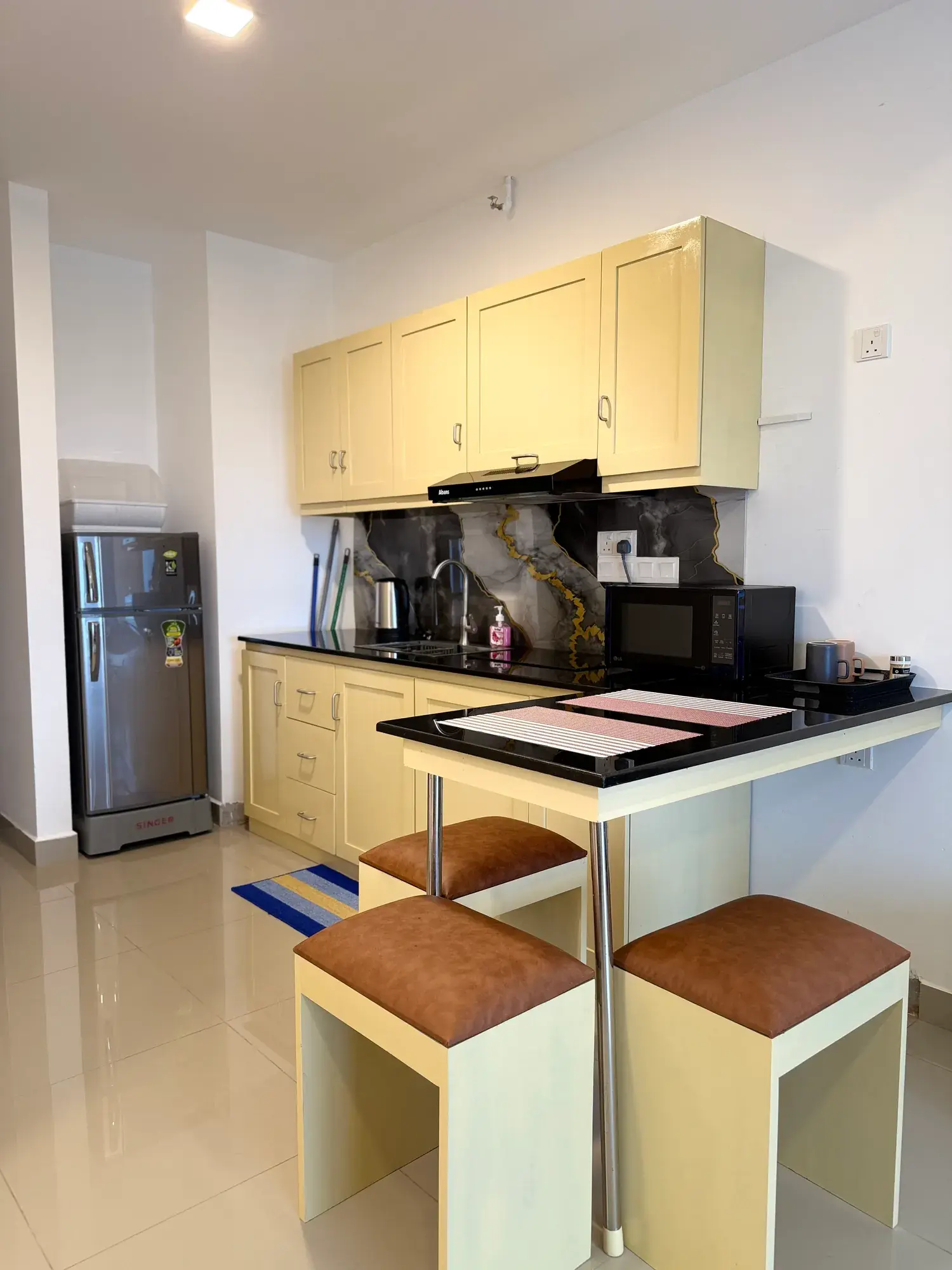 Kitchen with a breakfast counter and stools