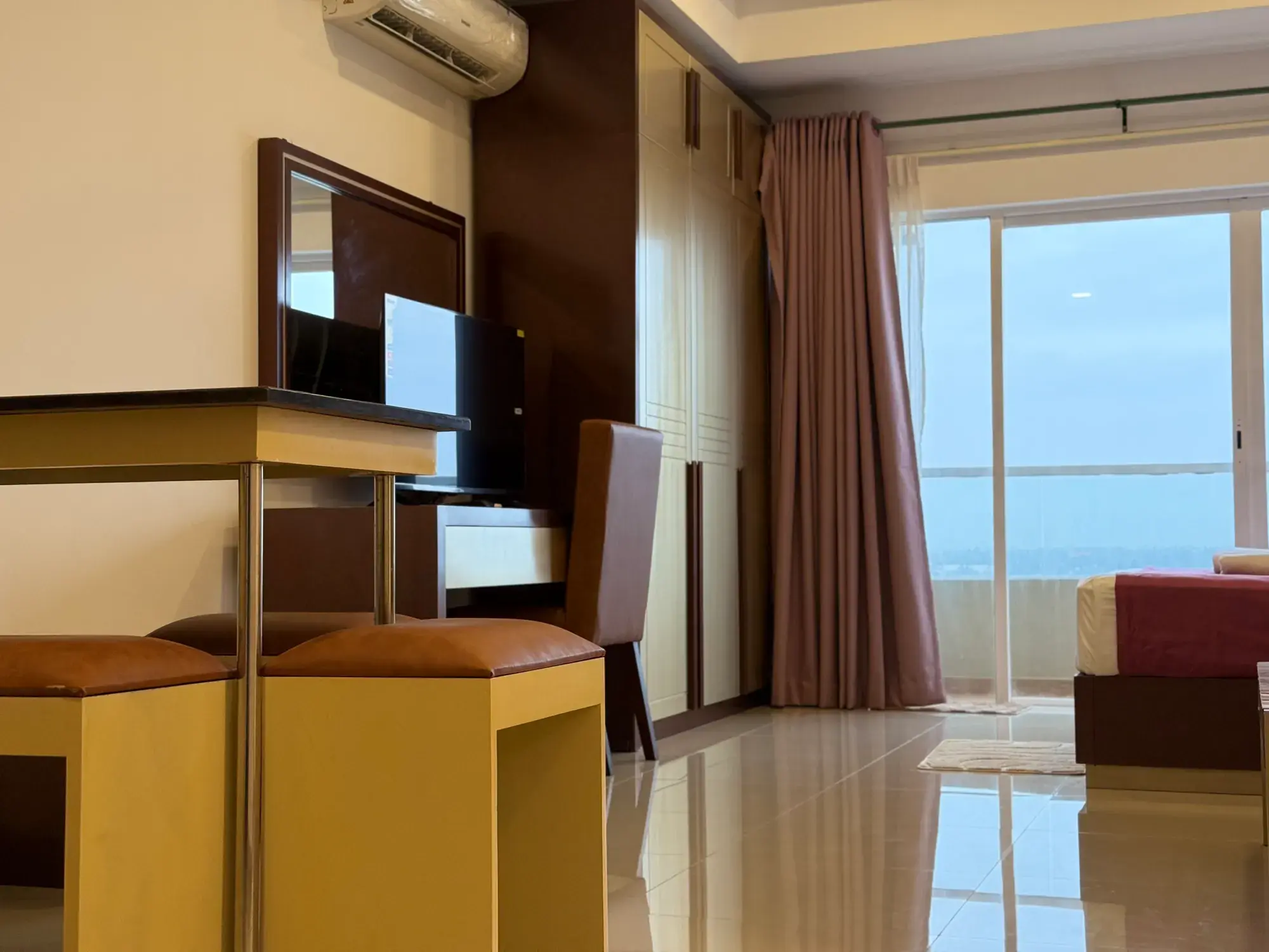 Desk and TV near the windows