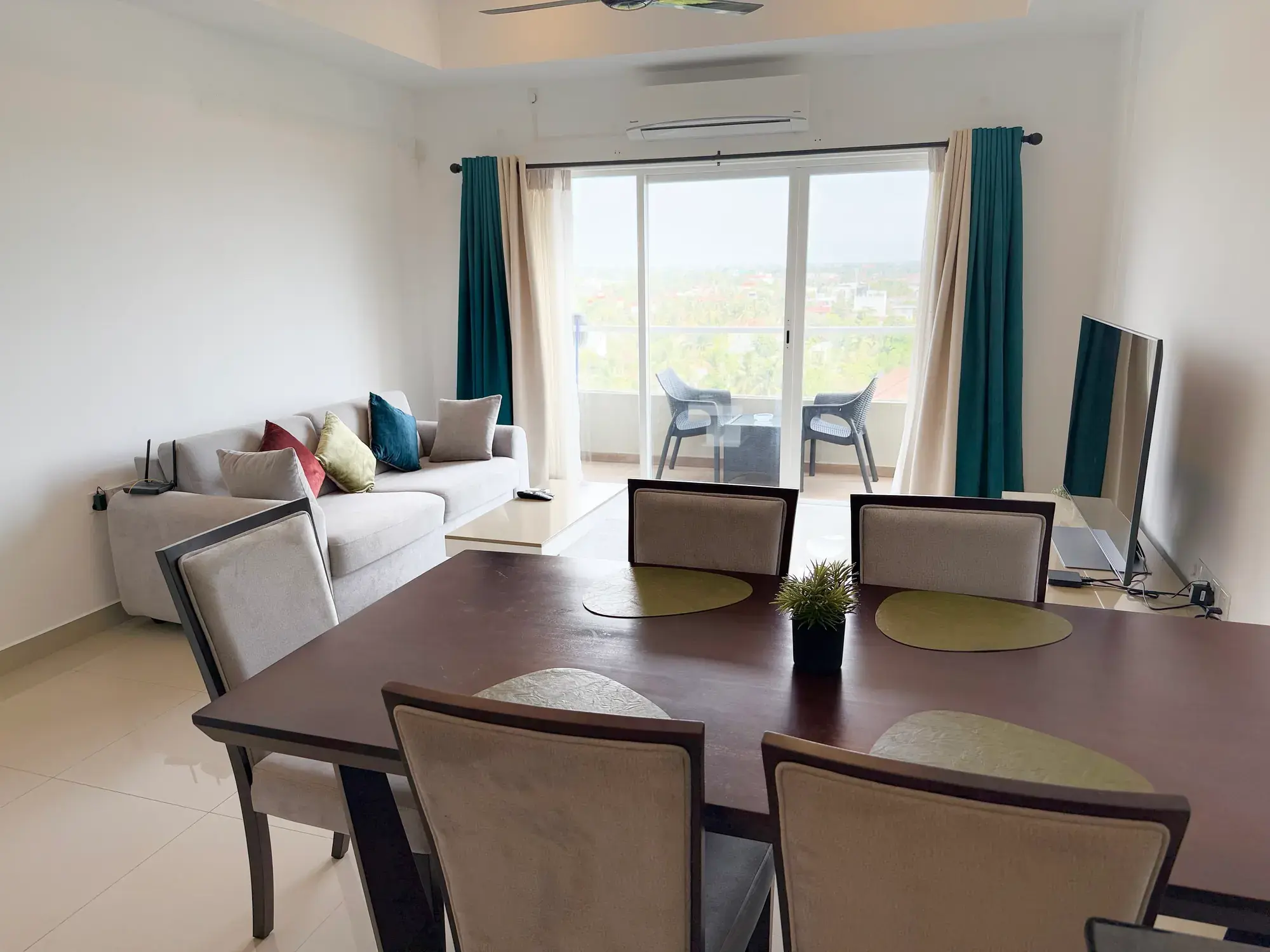 Dining table with the living room behind