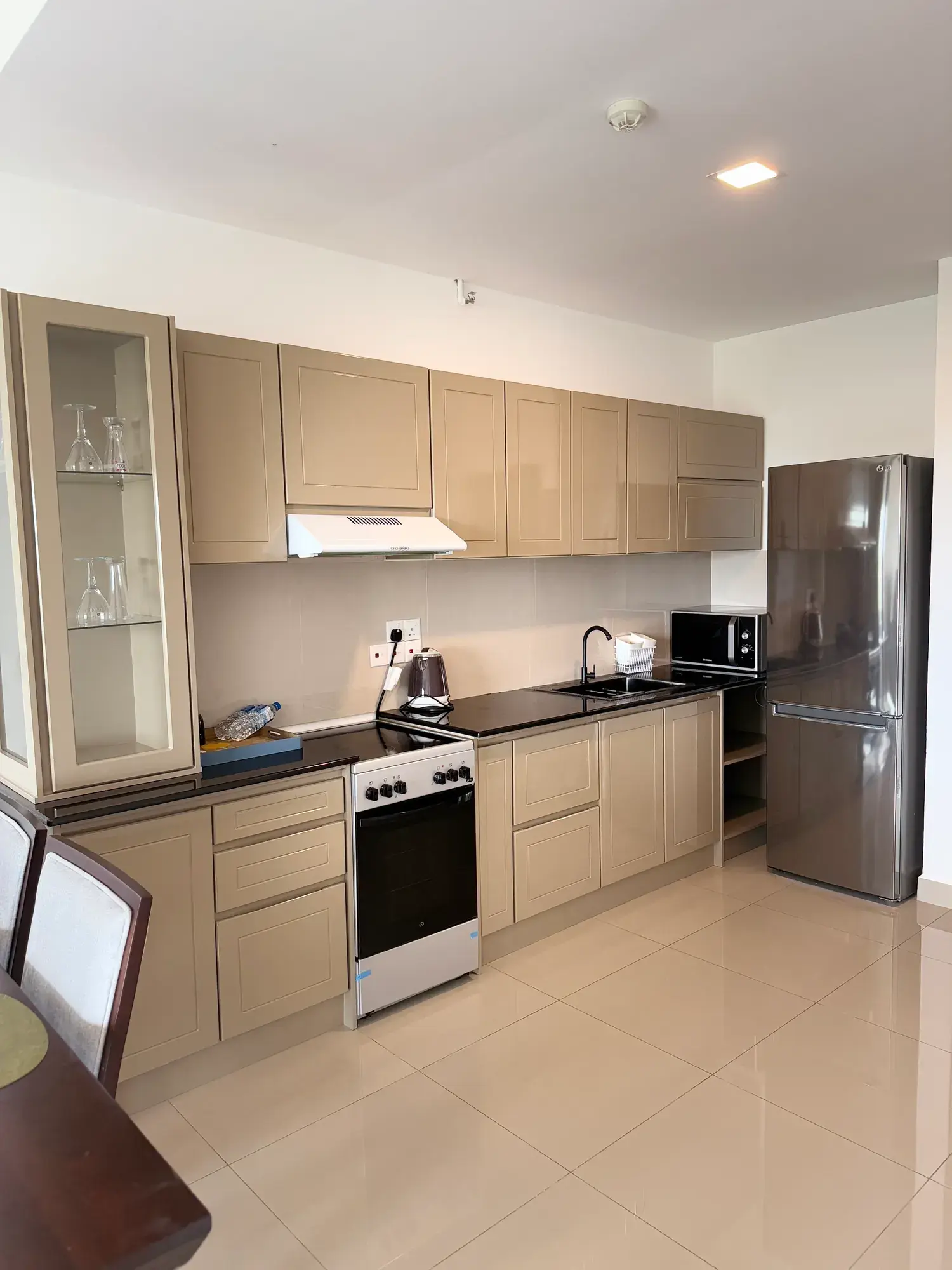 Kitchen with an oven and a tall fridge