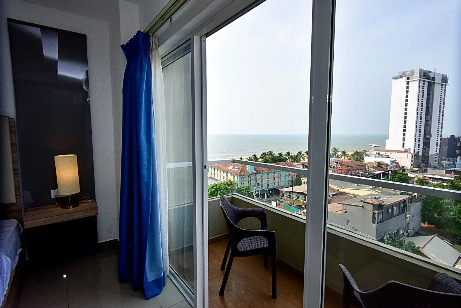 Balcony doors with a chair outside